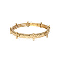 Gold bracelet on a white background
