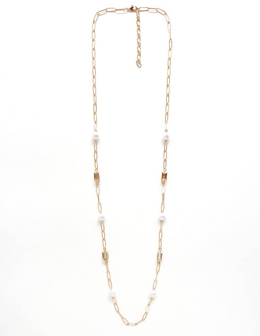 Gold chain necklace with small pearls on a white background