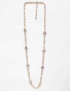 Gold chain necklace on a white background