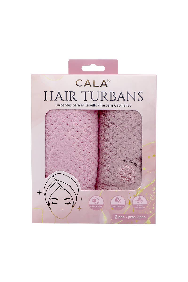 Packaging of Cala Hair Turbans with two pink turbans inside on a white background.