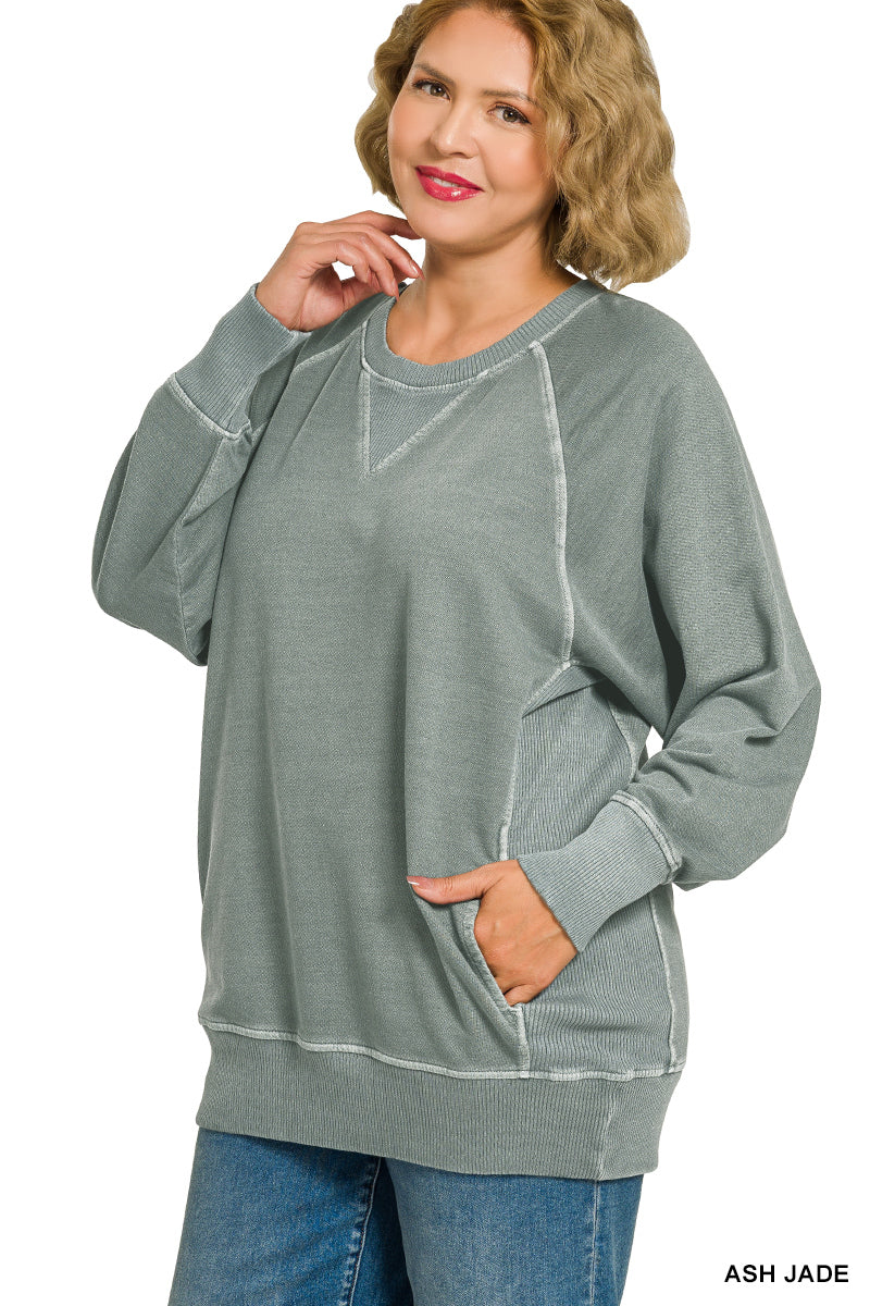 Woman wearing a gray sweatshirt with white accents on a white background