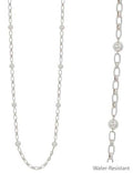 Silver chain necklace with embedded beads on a white background