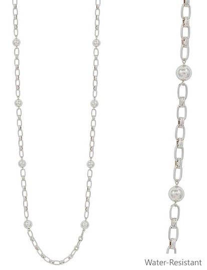Silver chain necklace with embedded beads on a white background