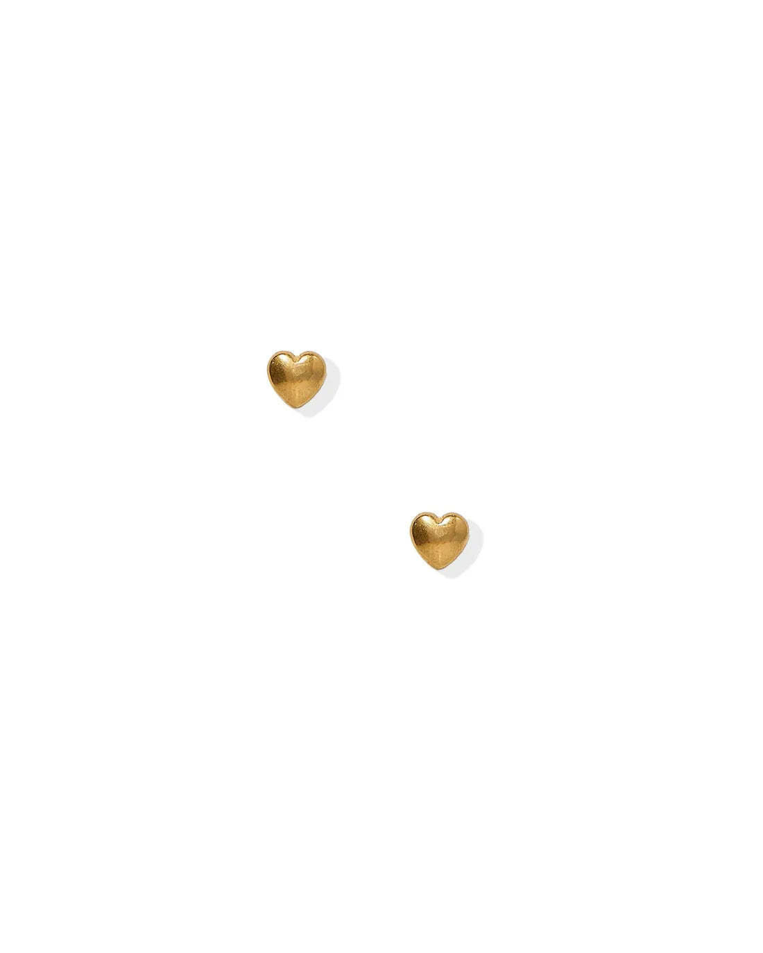 Two gold heart-shaped earrings on a white background